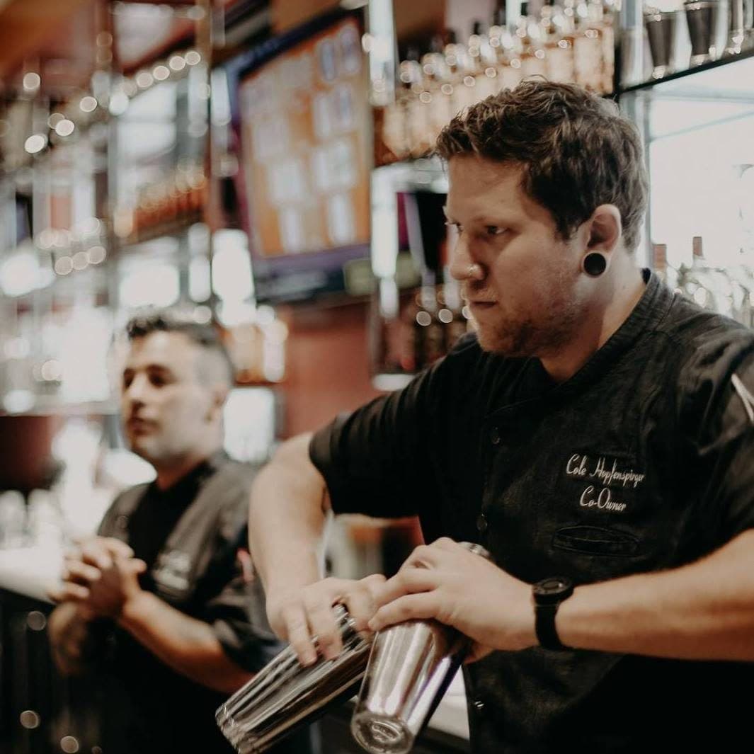 Cole Hopfenspirger behind the bar